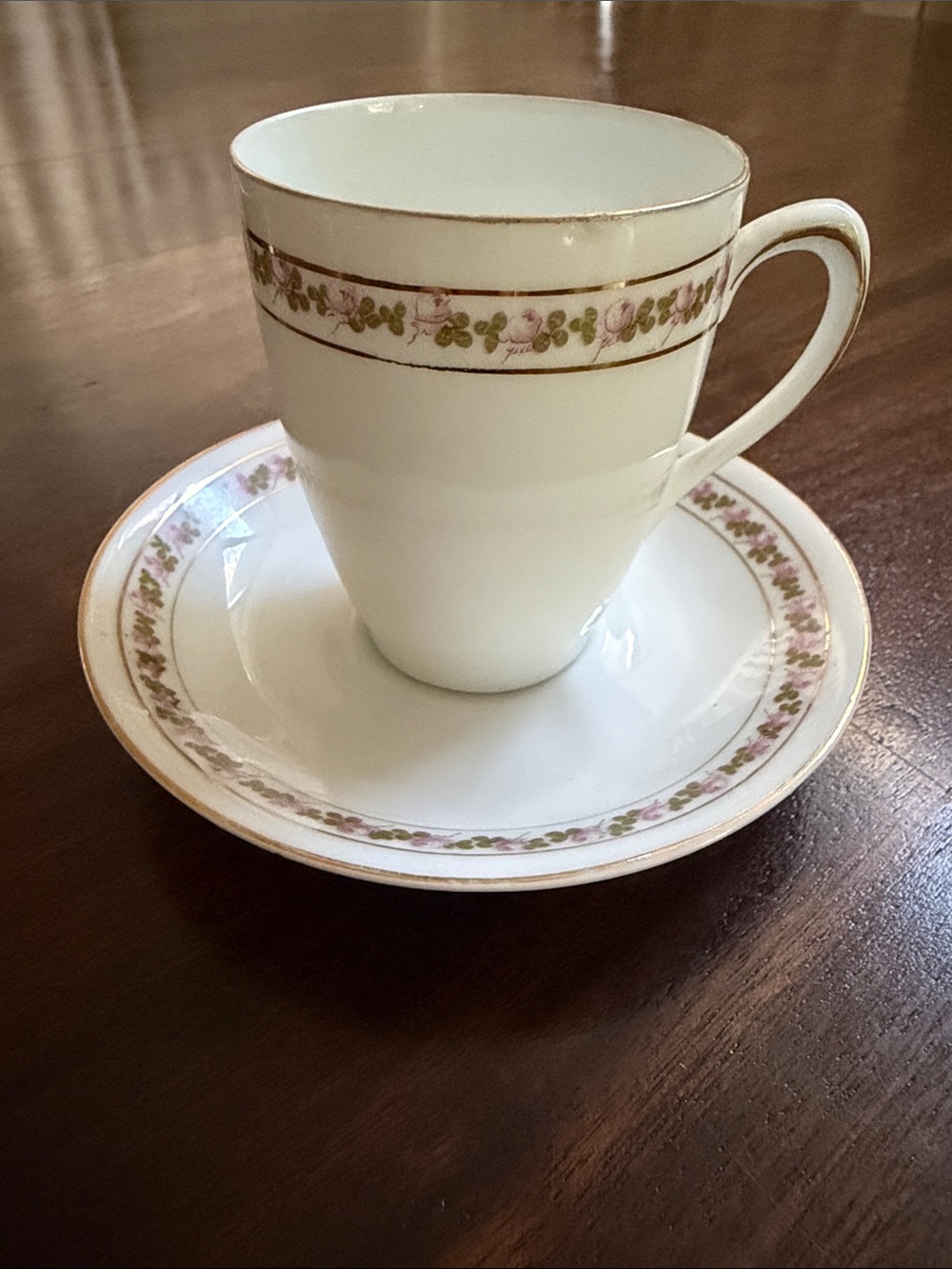 Elegant White Porcelain Teacup and Saucer with Pink Floral Border by Empire